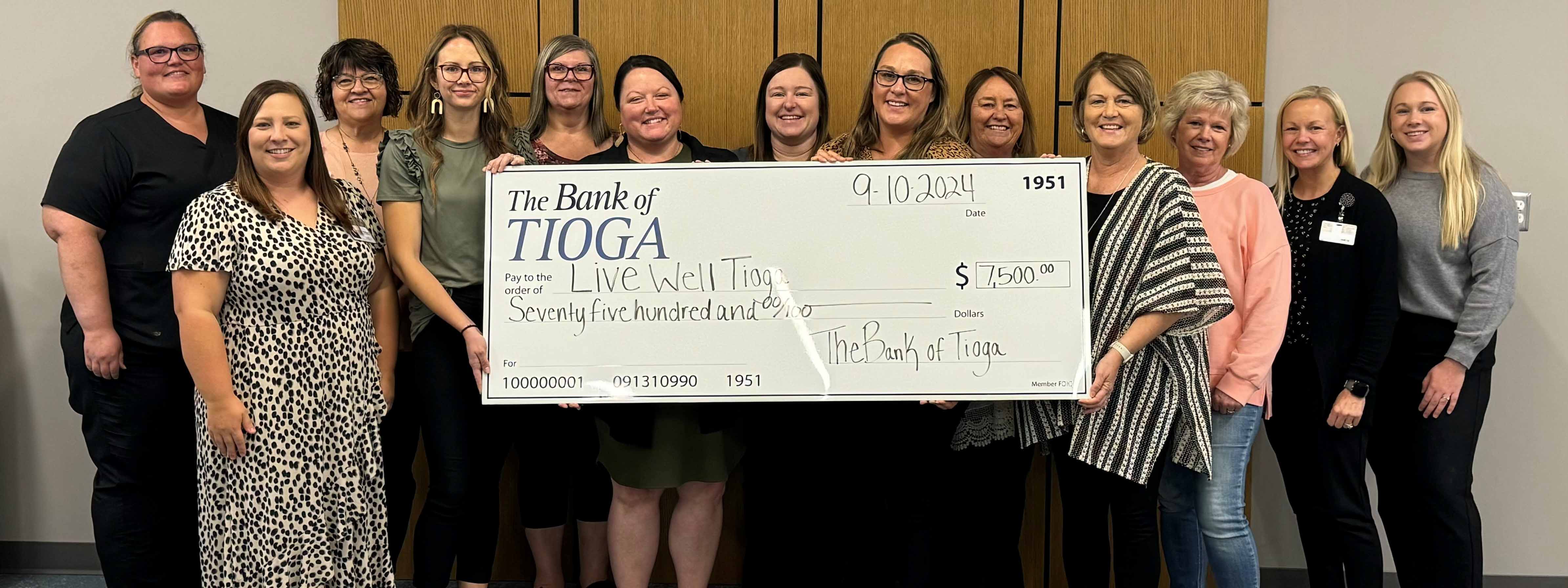 The Bank of Tioga employees gift check to Live Well Tio